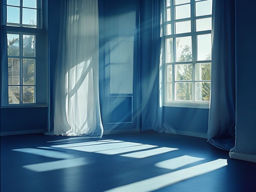Person doing a stretch in a bright, minimalist room